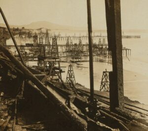 Pumping oil from the sea - oil wells in the surf of Summerland, California, U.S.A, by H.C. White Co.